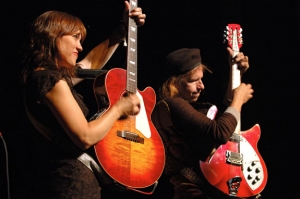 The Kennedys perform with their guitars