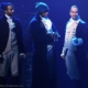 Photo of actors on stage during a production of Hamilton