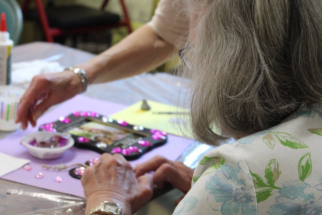 Participant in the In the Moment program creating art